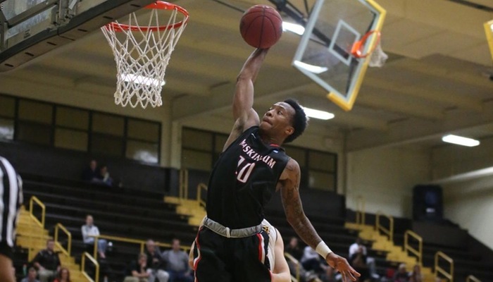 Muskingum sophomore Jarrell Marsh slams home two points for the Muskies in the opening half of the OAC Tournament Final Four against Baldwin Wallace. Photo Credit: Joe Colon, d3photography.com.
